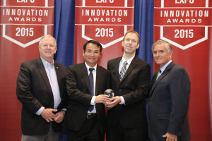 From left to right Tom Phoenix, ASHRAE and Ed Purvis, AHRI, congratulate Lin Sun, and Mogens Rasmussen from Danfoss on winning the 2015 AHR Expo Product of the Year. Danfoss’ Turbocor VTT Series Compressor was chosen from among the top Innovation Award winners in 10 industry-specific categories for this special honor. 